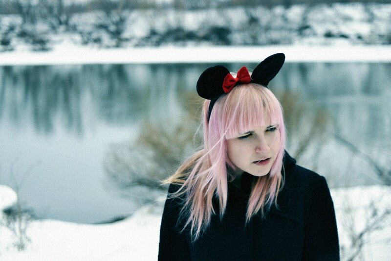 Person with pink hair in winter