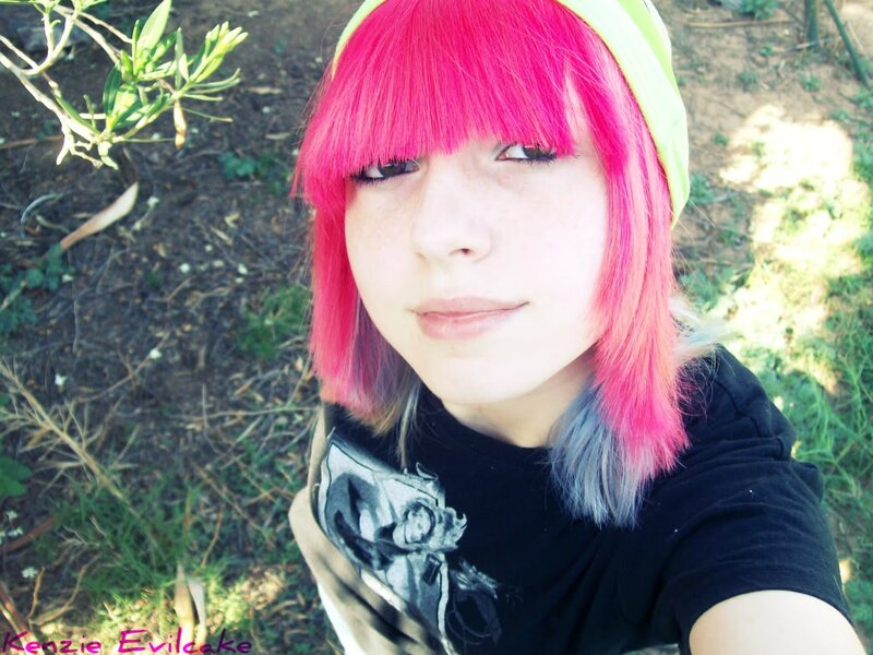 person with pink hair outdoors