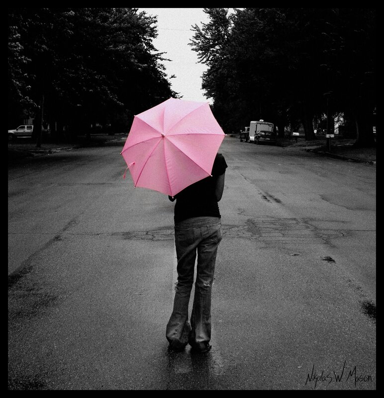 person with pink umbrella
