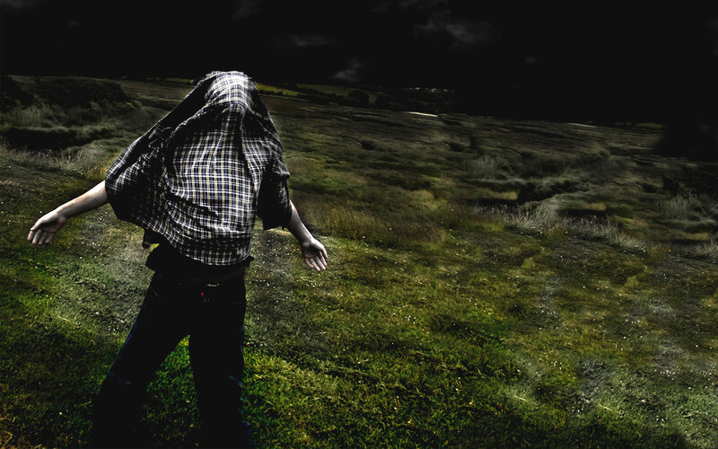 person with plaid shirt covering face
