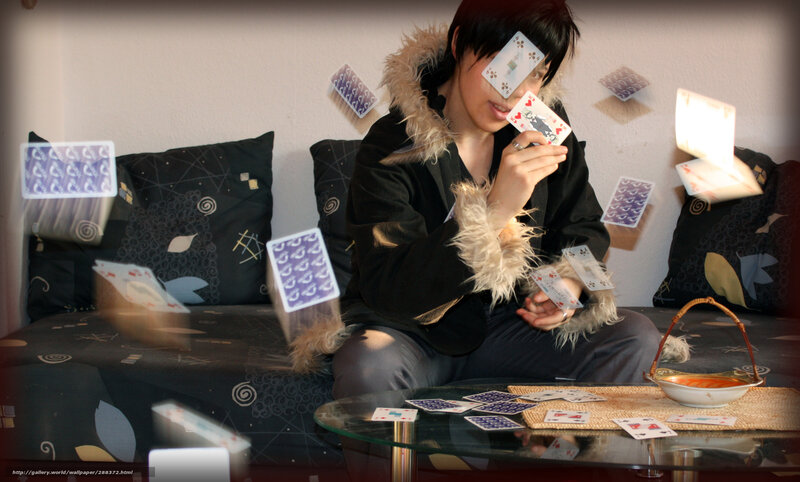 person with playing cards
