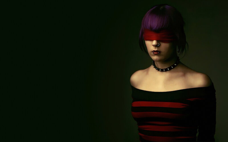 person with purple hair and blindfold