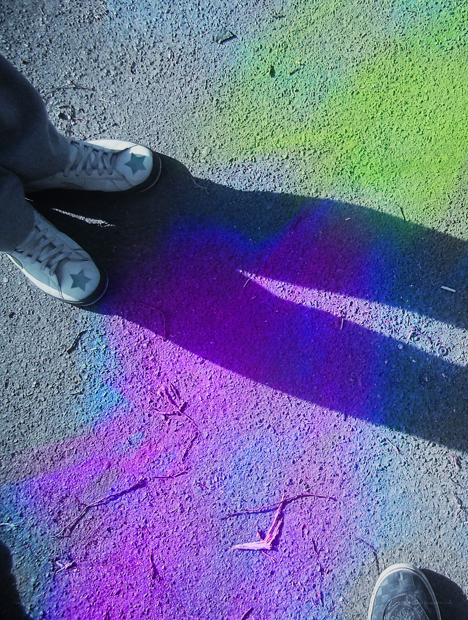 person with rainbow shadow