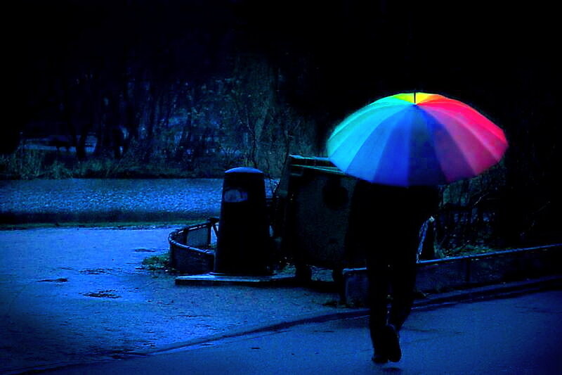Person with Rainbow Umbrella — Blue