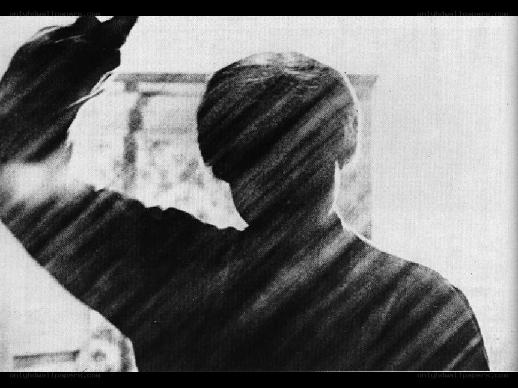 person with raised arm