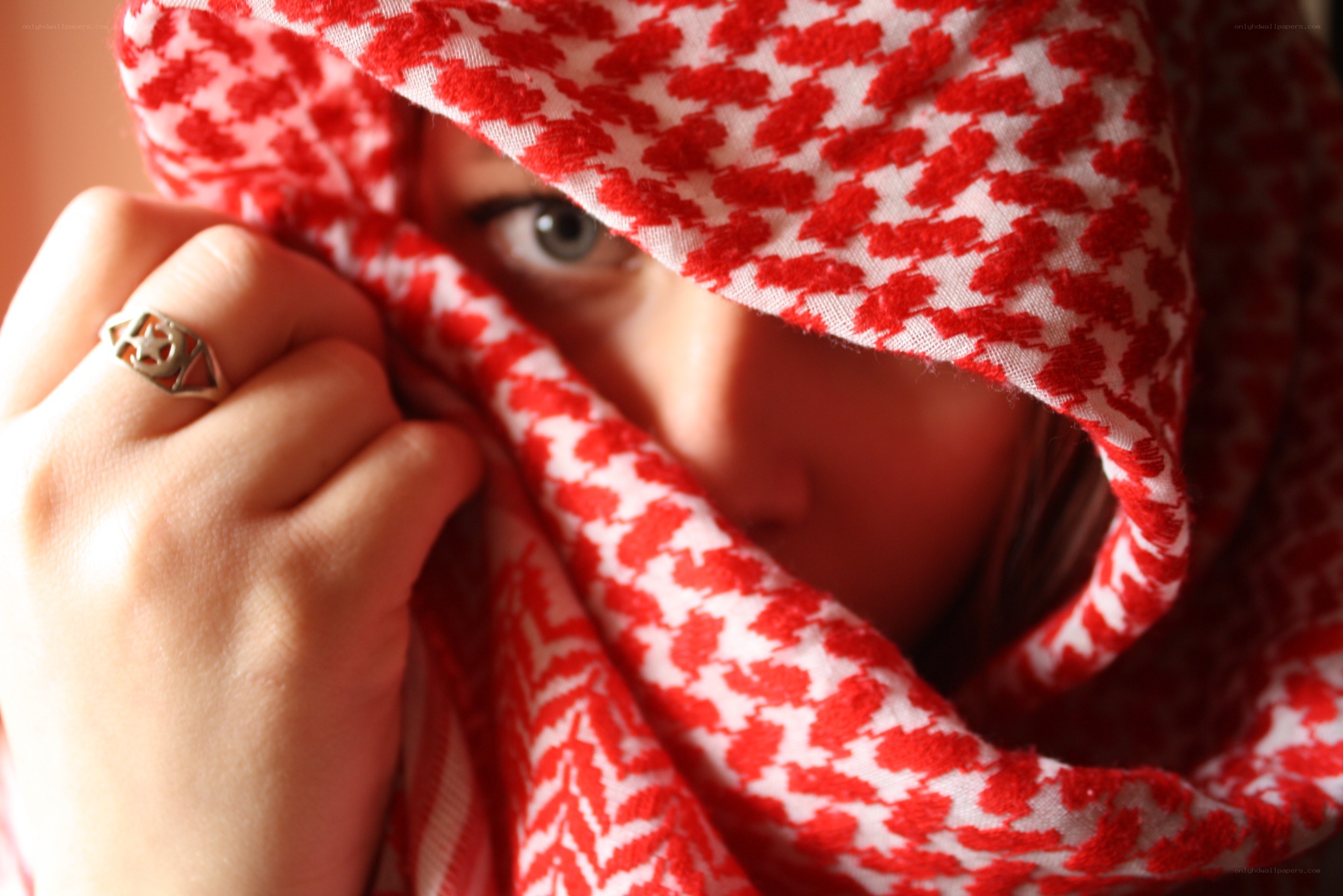 person with red and white scarf