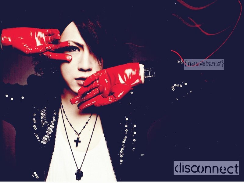 person with red gloves and dark background