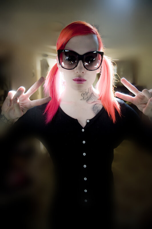 person with red hair and sunglasses