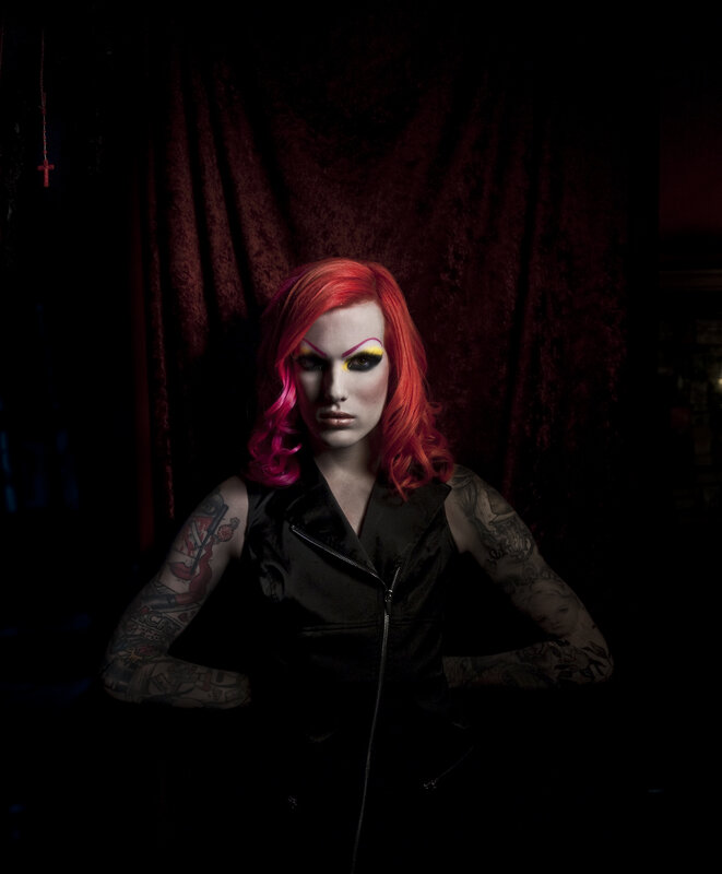 person with red hair and tattoos