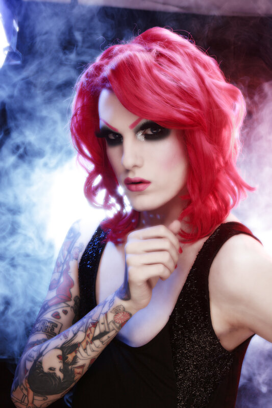 person with red hair and tattoos