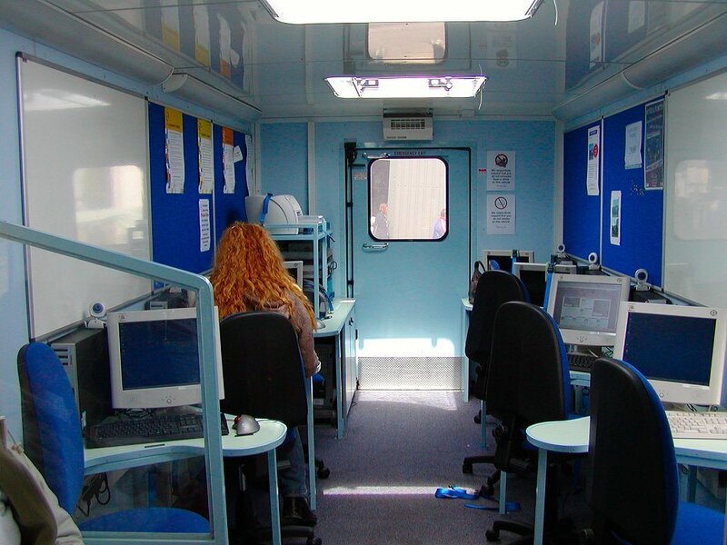 Person with Red Hair at Computer