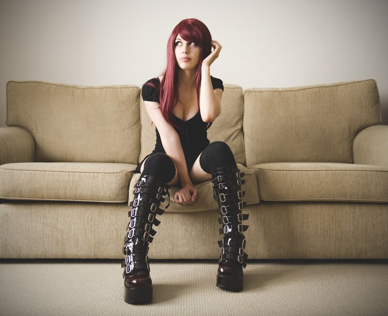 Person with Red Hair — Contemplative, Photograph, Sofa