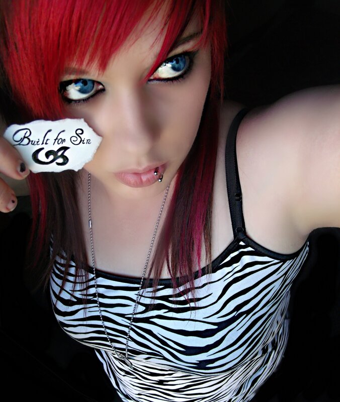 person with red hair holding paper