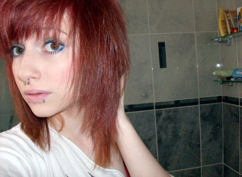 person with red hair in bathroom