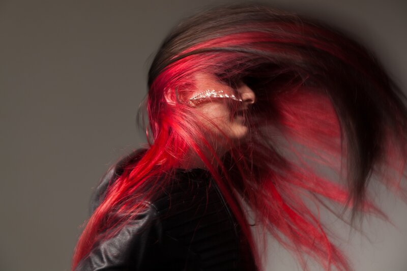 person with red hair in motion