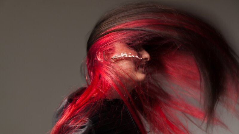person with red hair in motion