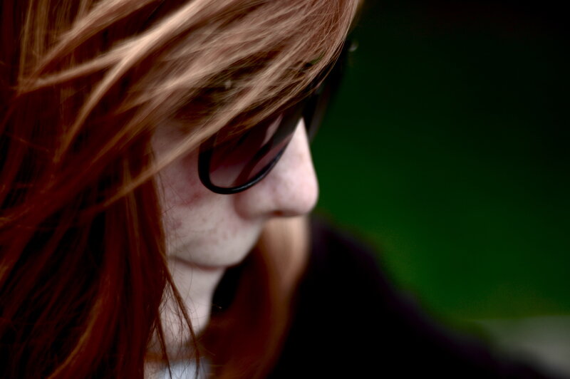 person with red hair in profile
