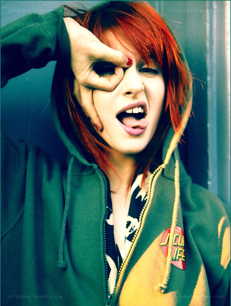 person with red hair making a face