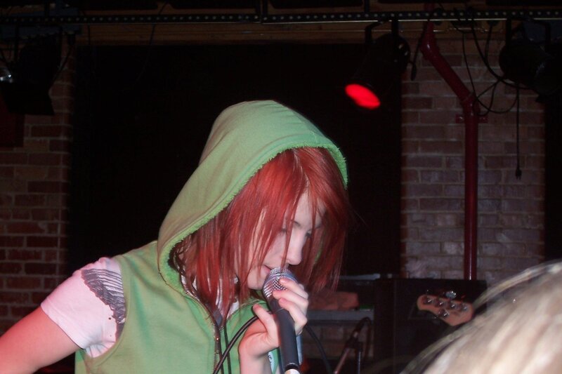 Person with Red Hair Singing — Green