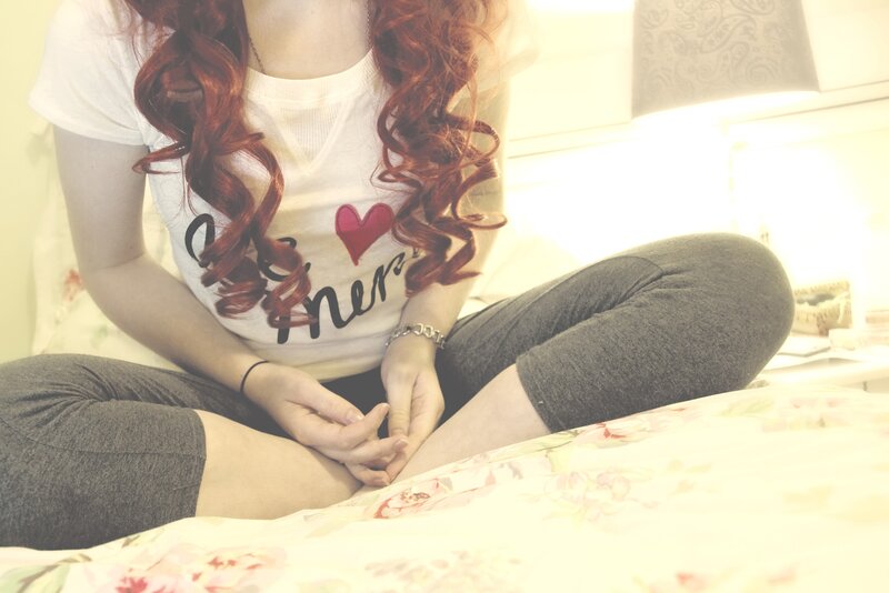 person with red hair sitting