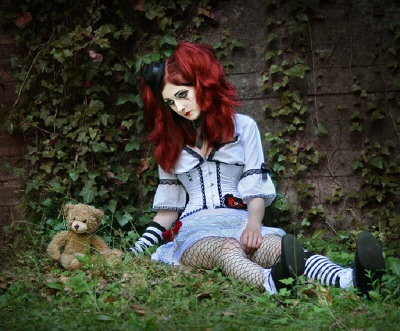 Person with Red Hair Sitting — Melancholic
