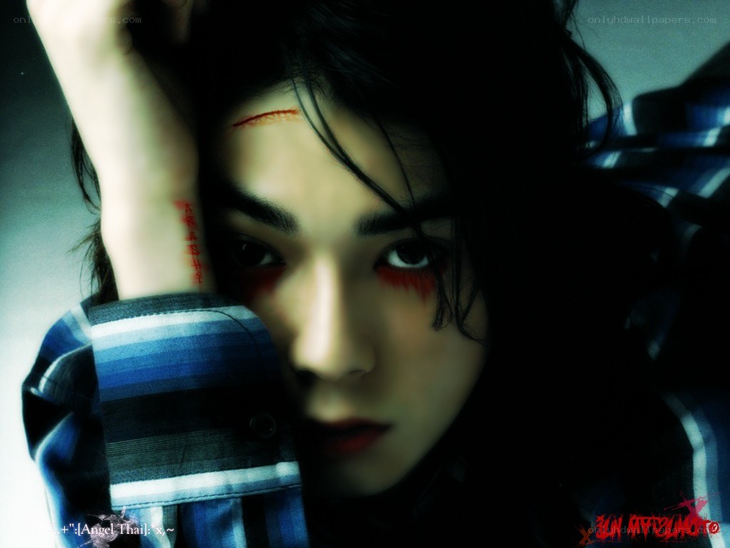 person with red makeup and markings