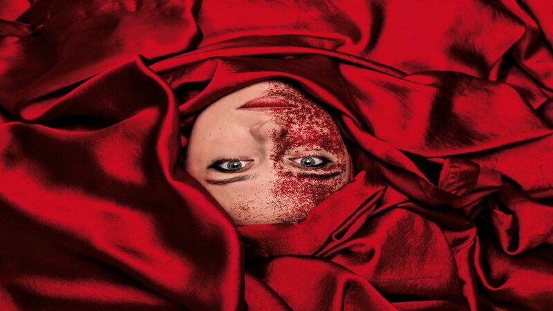 Person with Red Powder on Face