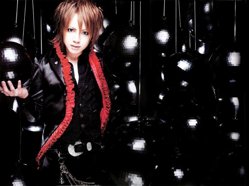 person with red scarf and black jacket