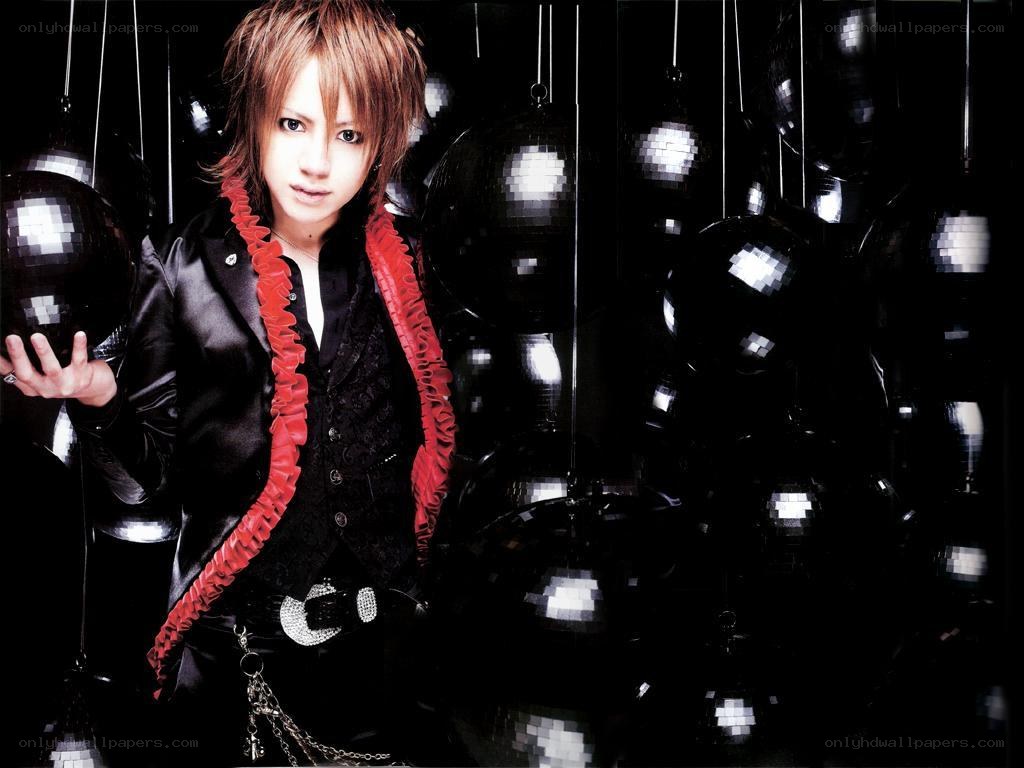 person with red scarf and black jacket