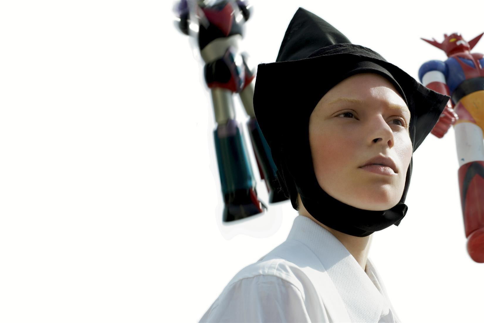 person with robot figures in background
