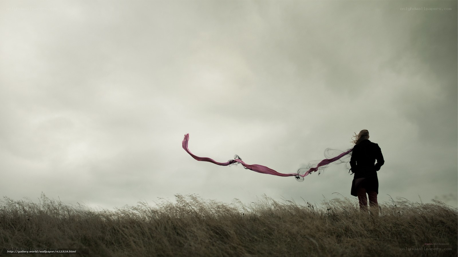 Person with scarf in field