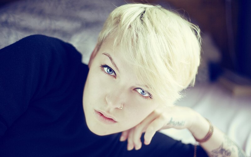 person with short blonde hair