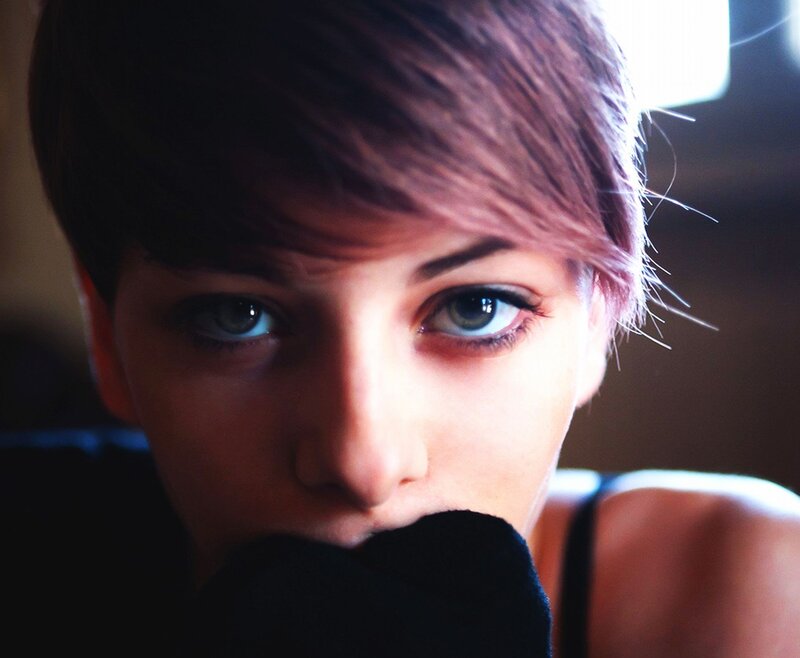 person with short hair and blue eyes