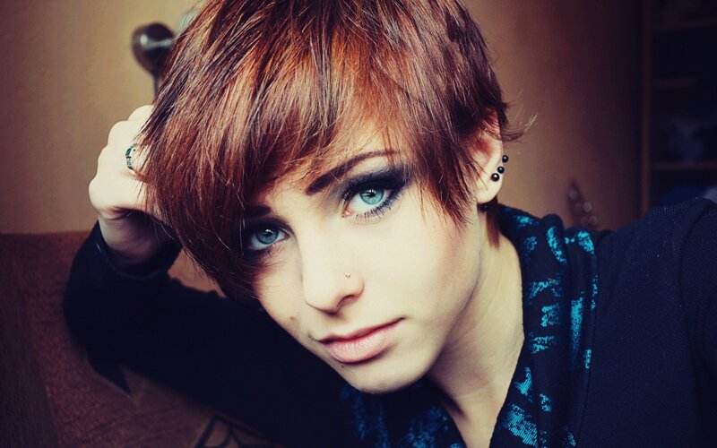 person with short hair and blue eyes