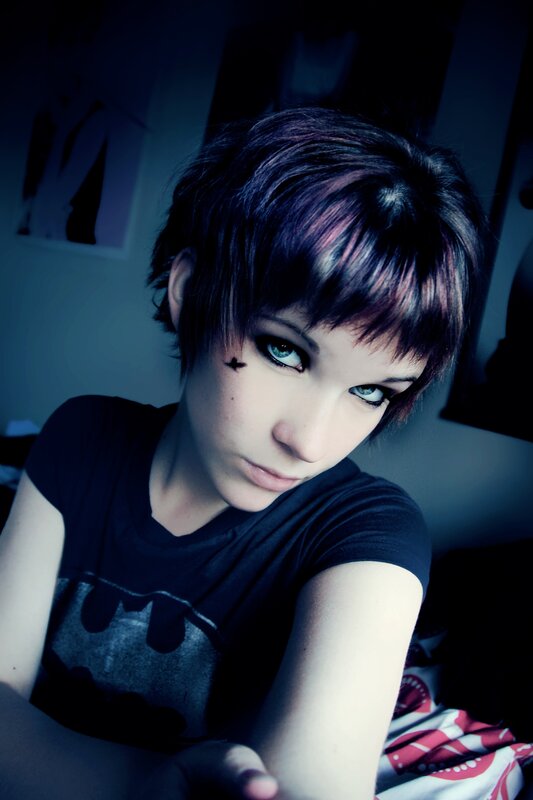 person with short hair and makeup
