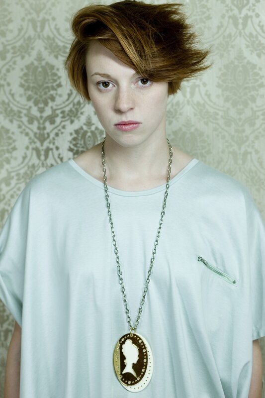 person with short hair and pendant