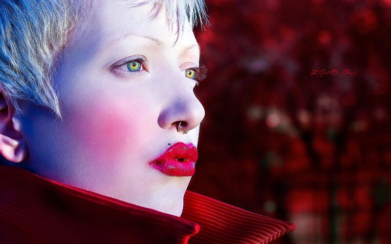 person with short hair and red lips