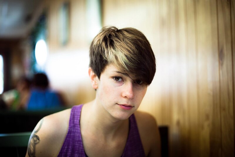 person with short hair in restaurant