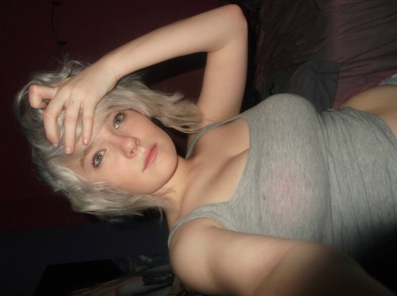person with silver hair lying down