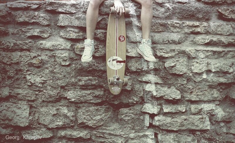 person with skateboard on wall