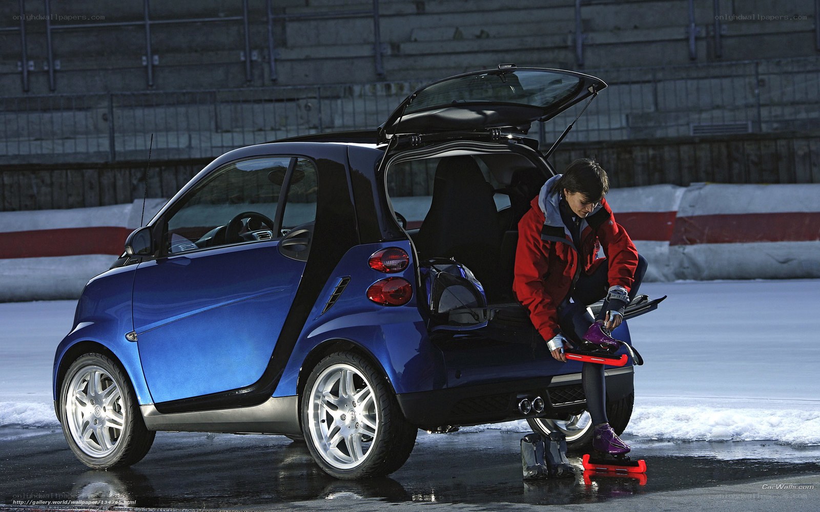 person with skates by car