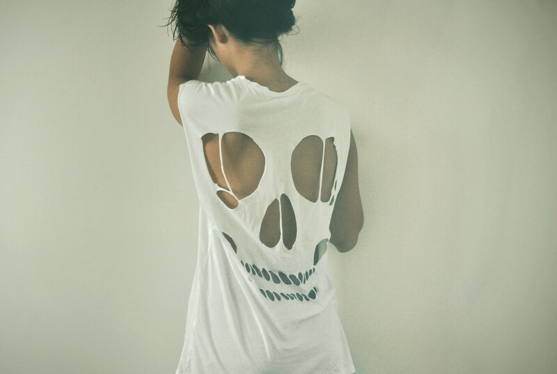 person with skull cutout shirt