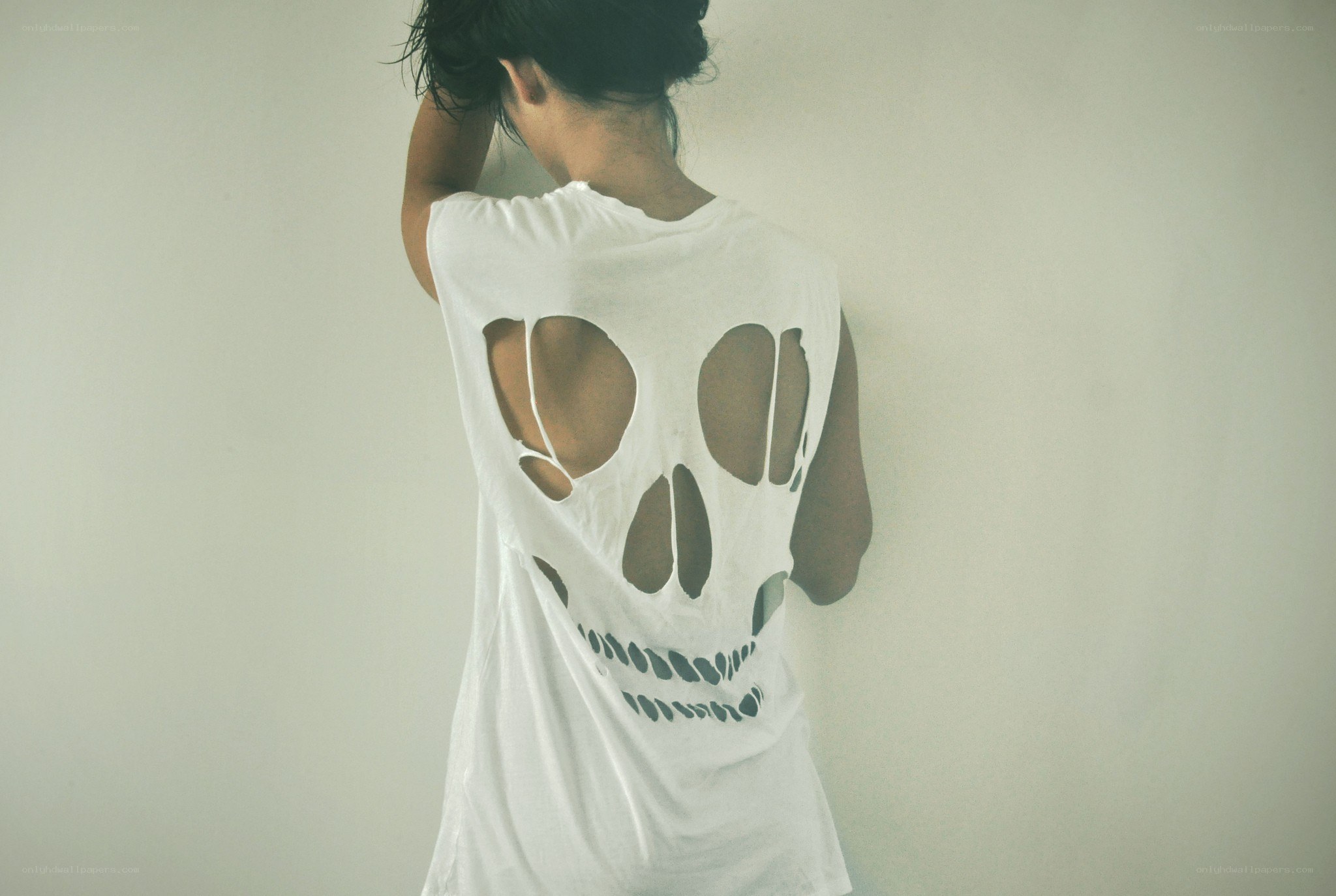 person with skull cutout shirt
