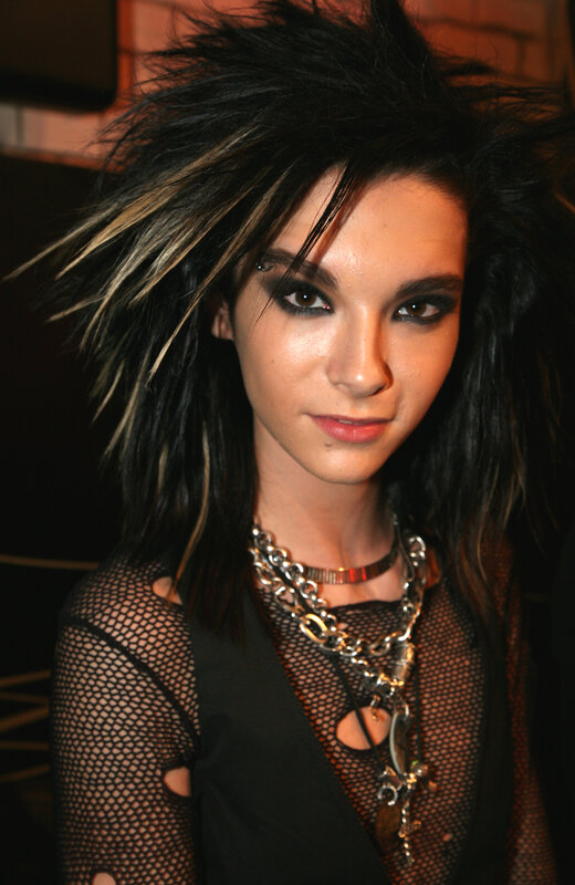 person with spiky hair and mesh top