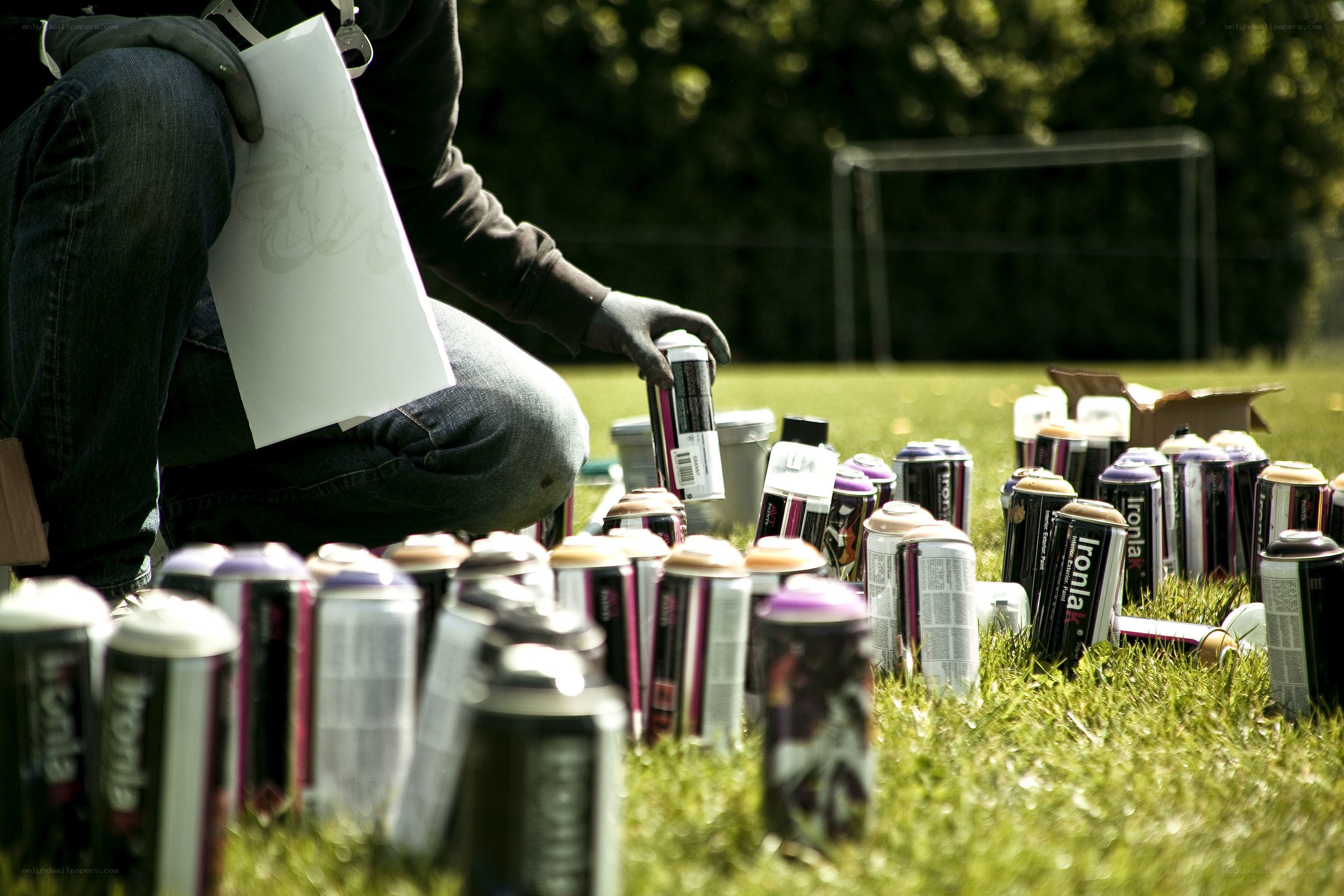 Person with spray paint cans