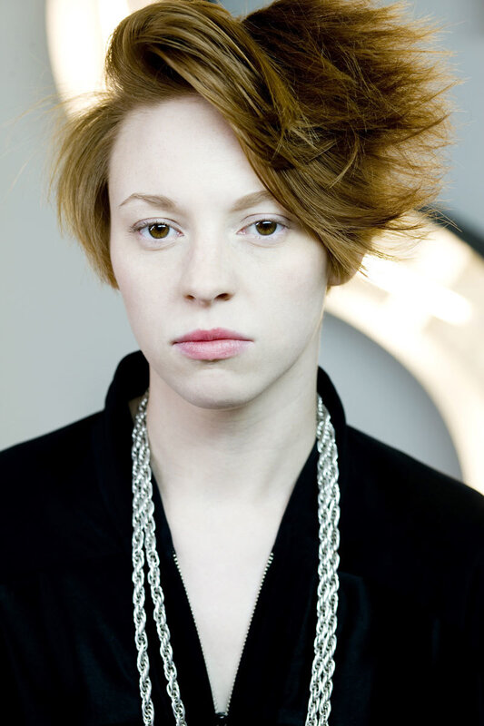 person with styled hair and chains