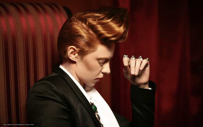 person with styled hair in suit