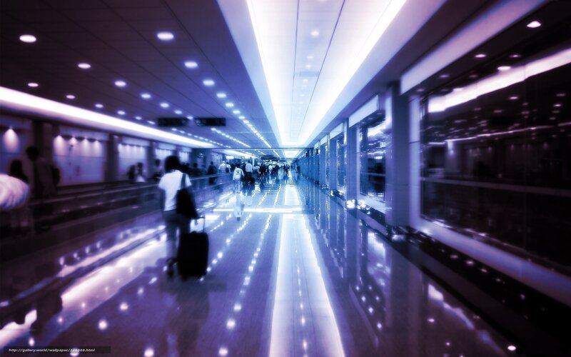 Person with Suitcase in Corridor