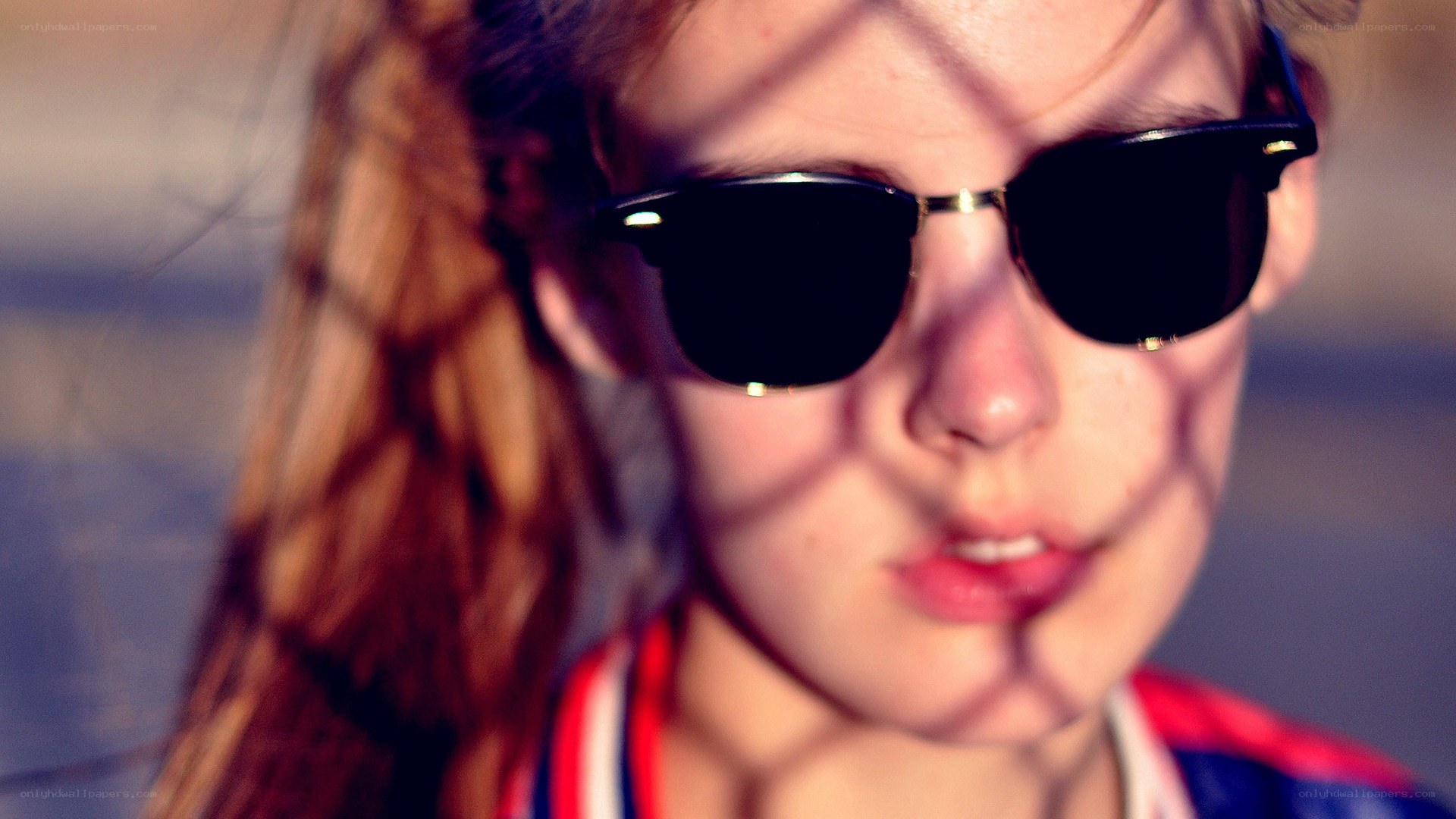 person with sunglasses and shadow
