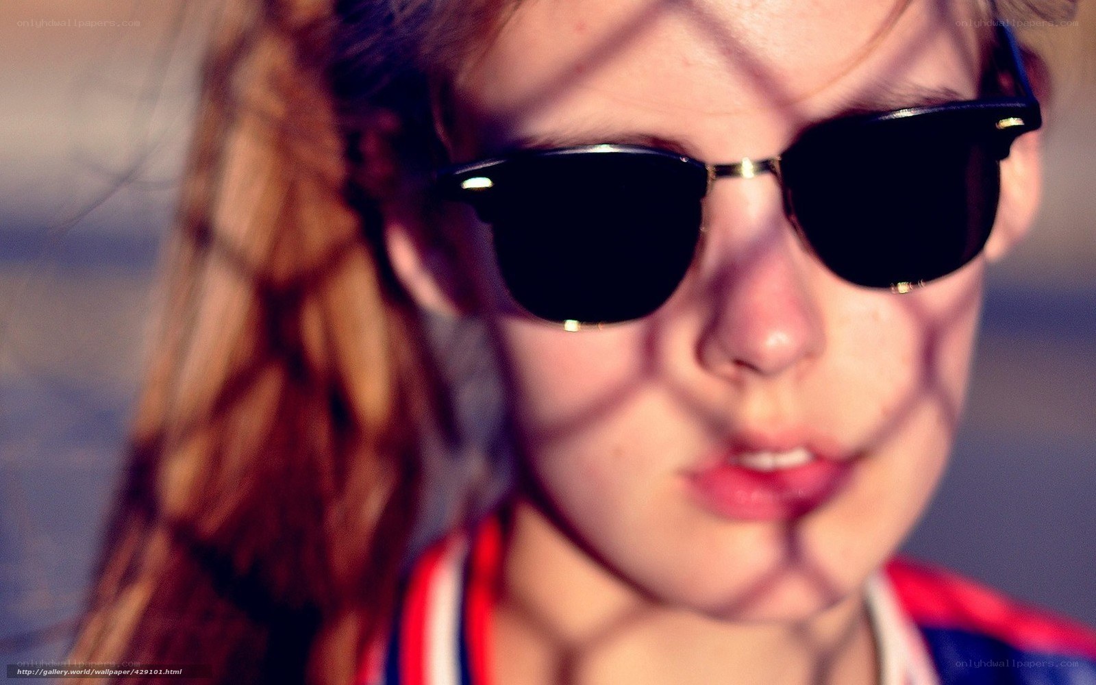 person with sunglasses and shadow